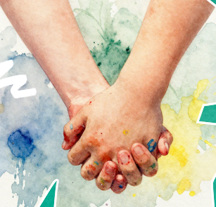 Hands joined over colorful artwork